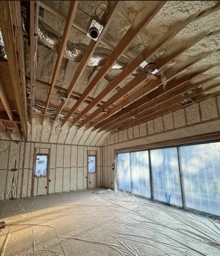 Interior walls and ceiling insulated with spray foam during new construction in Elbridge